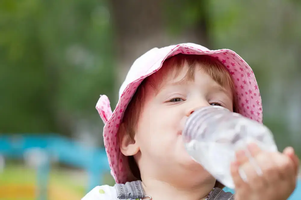 2 years child drinking from bottle