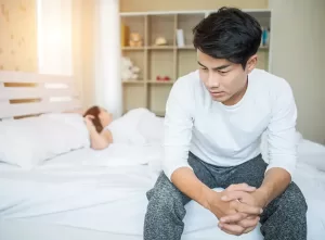 upset-man-having-problem-sitting-bed-after-arguing-with-his-girlfriend-_1_ (1)